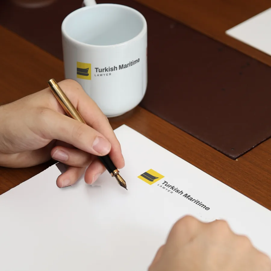 Signing a document on the practice letterhead at the Istanbul office